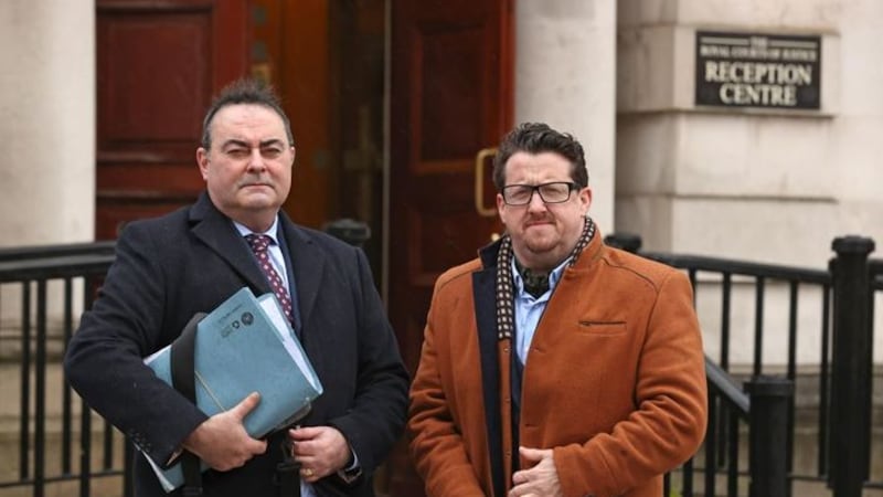 &nbsp;Sean Napier (right) and his solicitor Paul Farrell arrive at the Royal Courts of Justice in Belfast for a hearing in his legal challenge against the DUP's boycott of cross-border political meetings. Picture date: Tuesday December