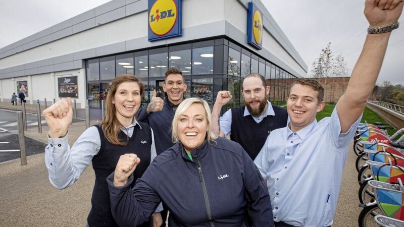 Staff at Lidl celebrate news that 300 workers in the north will have their hourly rate increased to &pound;9.30 