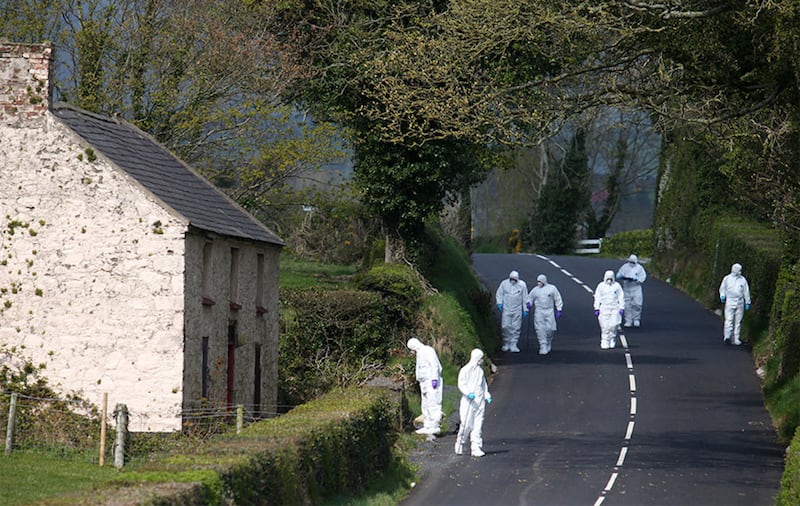 PSNI forensic teams outside Castlewellan, Co Down, where a mortar bomb launching tube was found. Picture by Mal McCann