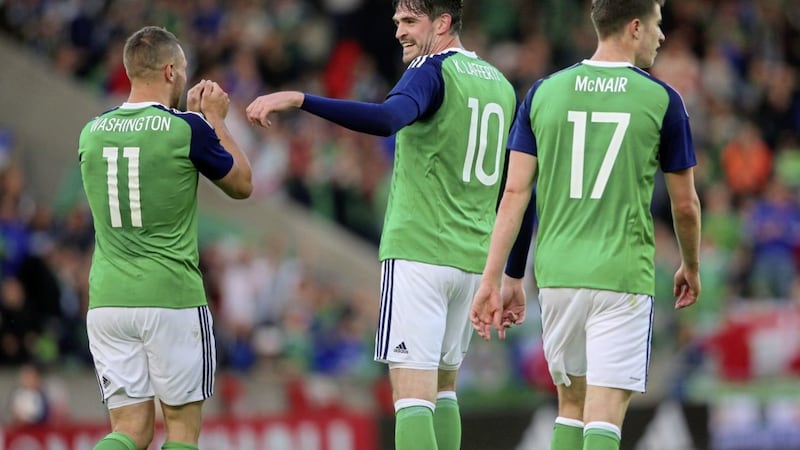 Northern Ireland&#39;s Conor Washington (left) celebrates with team-mate Kyle Lafferty (centre) after scoring his side&#39;s second goal during an international friendly against Belarus six years ago. 