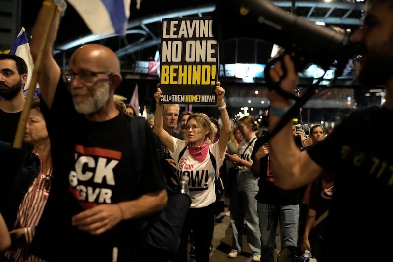 People in Tel Aviv protest against Israeli Prime Minister Benjamin Netanyahu’s government and call for the release of hostages held in the Gaza Strip by Hamas (Leo Correa/AP)