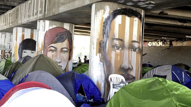 Migrants camp under a bridge in Paris. Picture by Elaine Ganley, Press Association 