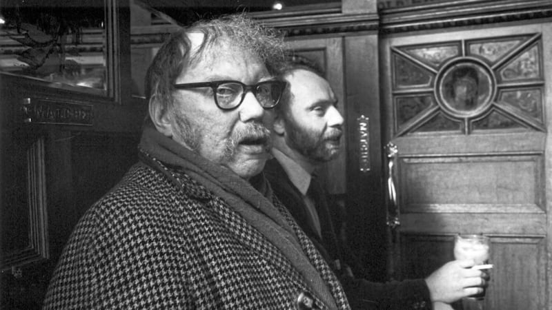 The late poet Padraic Fiacc with Brian Keenan in the Crown Bar, Belfast in 1984, two years before the latter was kidnapped in Beirut. Picture by John Minihan 