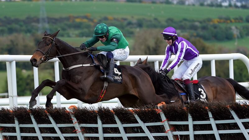 Impaire Et Passe, ridden by Paul Townend, jumps ahead of High Definition and JJ Slevin to win the Alanna Homes Champion Novice Hurdle on day four of the Punchestown Festival. Picture by PA