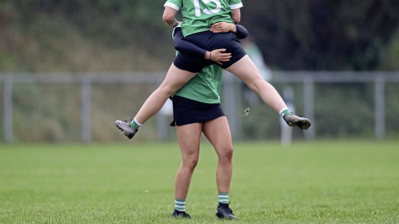 Bridini Oga corner forward Aimee Traynor celebrates with a team mate at the final whistle of Saturday&#39;s Ulster Junior Camogie final win over Granemore of Armagh at Derrytresk. Pic by Dylan McIlwaine. 