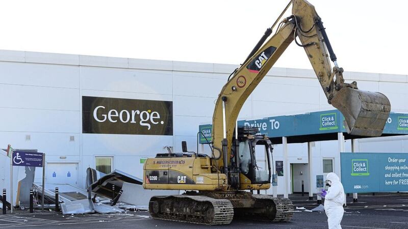 A digger was used to steal two cash machines at the Asda store in Antrim. Picture by Arthur Allison/Pacemaker Press 