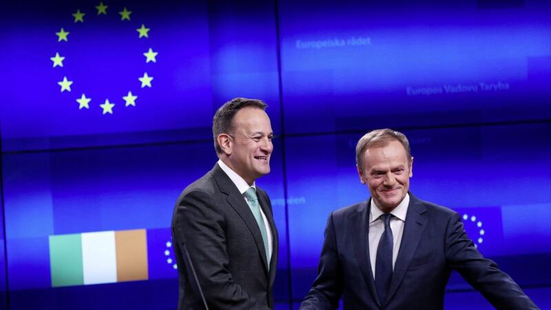 Leo Varadkar (left) shakes hands with European Council President Donald Tusk in Brussels last week as they discuss Brexit hell. Picture by AP Photo/Francisco Seco