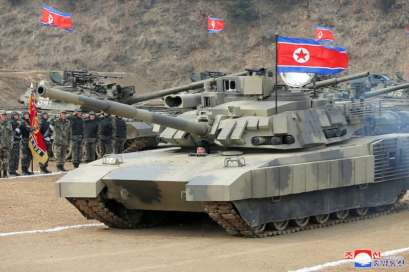 In images distributed by the Korean Central News Agency, Kim Jong Un drives a new-type tank in North Korea (Korean Central News Agency/Korea News Service via AP)