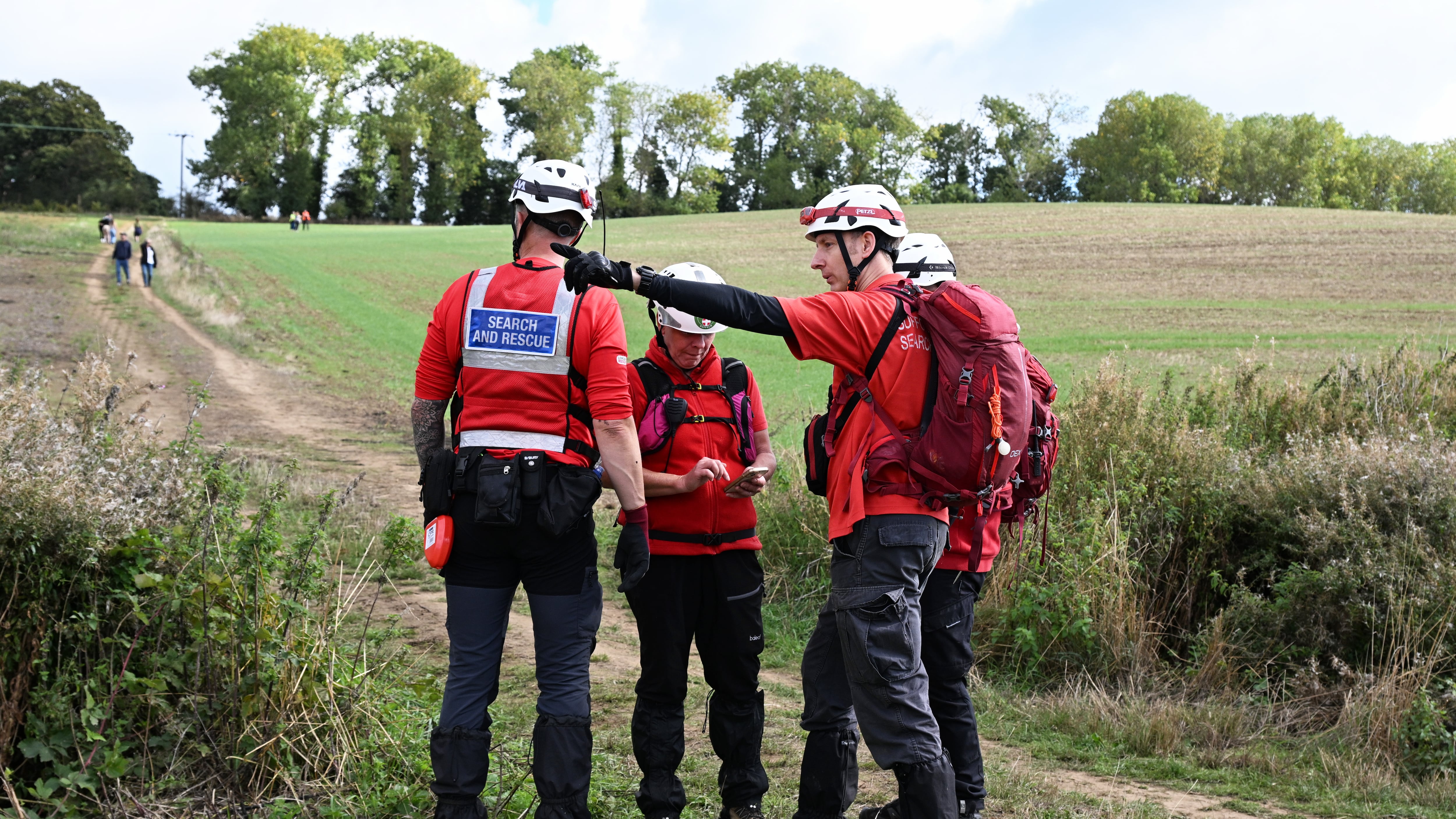 Members of a search and rescue team continue their search near Merriam Close, Brantham