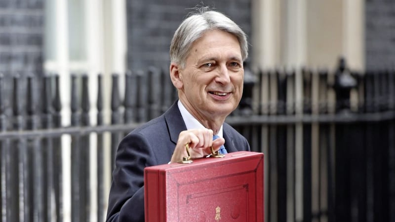 Chancellor Philip Hammond holding his red ministerial box outside 11 Downing Street before presenting his latest Budget 