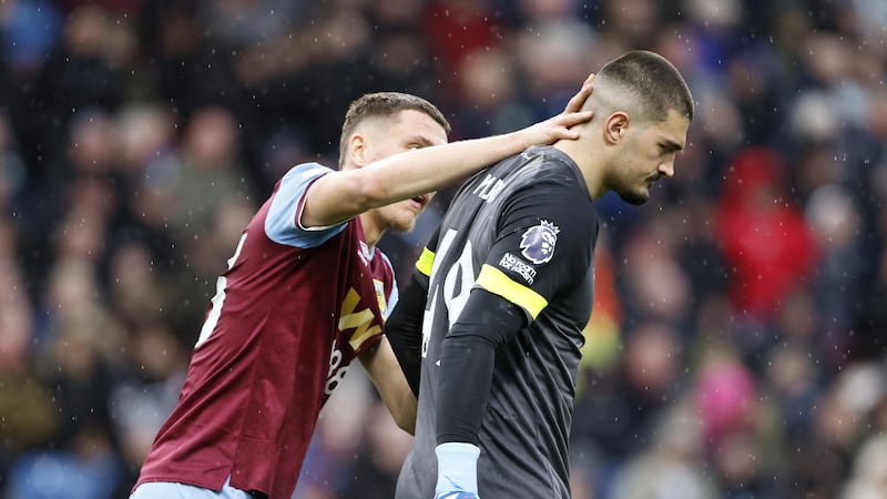 Burnley goalkeeper Arijanet Muric (right) reacts to his mistake against Brighton .