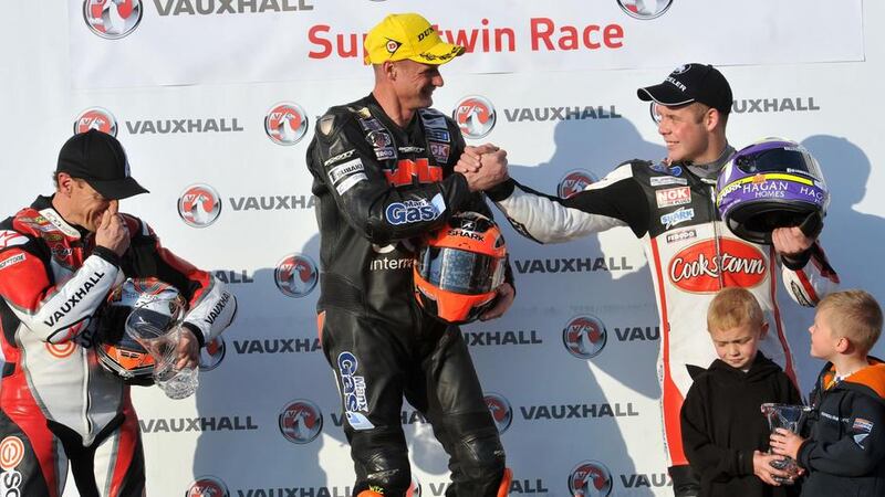 Ryan Farquhar takes the plaudits from team-mate Jeremy McWilliams following his victory at the North West 200 on Thursday <br />Picture: Pacemaker