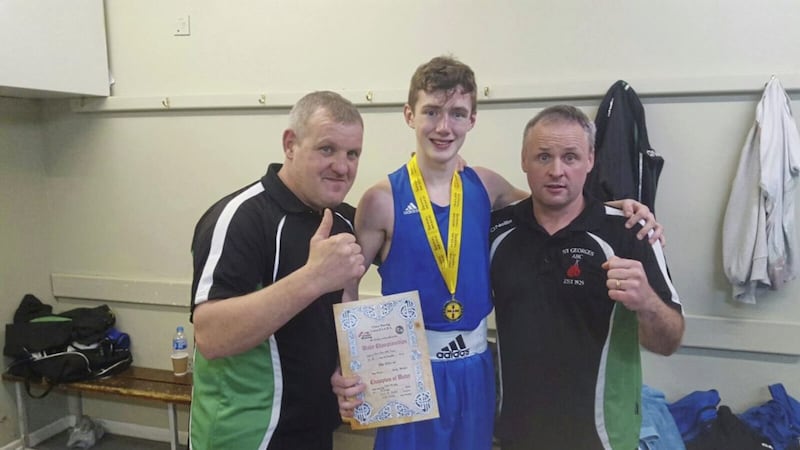 Colm Murphy (centre) with St George's coaches Danny Boyd and Jim McGivern