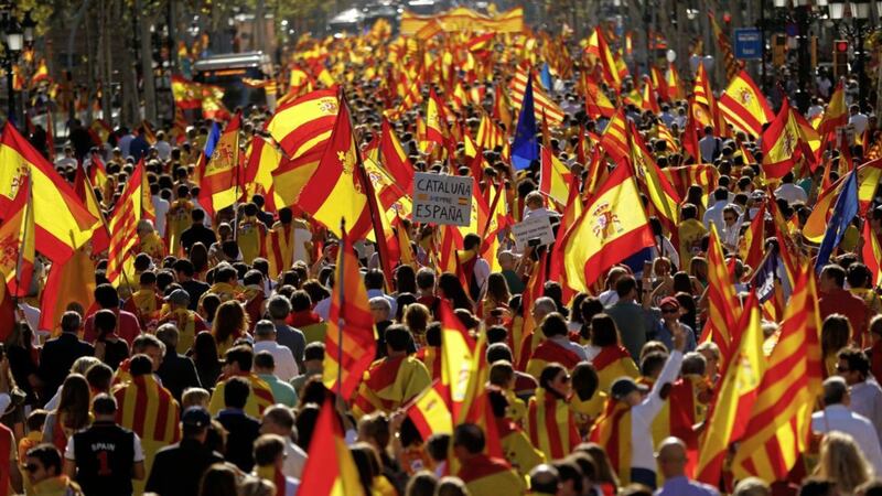 Demonstrators holding mostly Spanish flags march to protest the Catalan government&#39;s push for secession from the rest of Spain at a coffeeshop in downtown Barcelona PICTURE: Francisco Seco/AP 