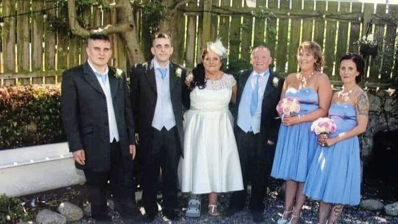 Marie Magee pictured on her wedding day to childhood sweetheart Mark, with Padraig (far left) 