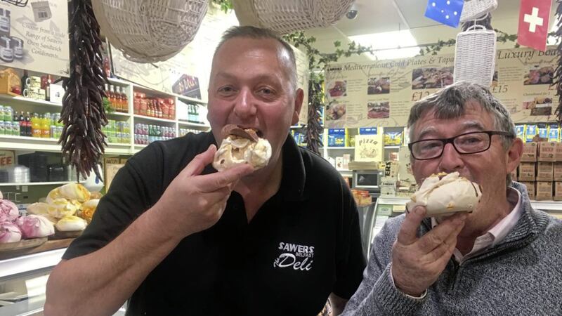 Kieran Sloan from Sawers Belfast and Patrick Finnegan tucking into fluffy meringues 