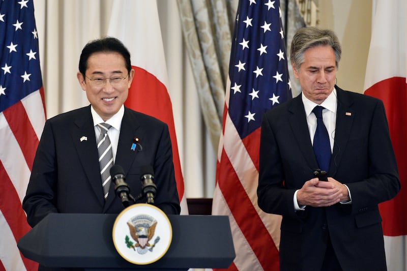Secretary of State Antony Blinken, right, listens as Japanese Prime Minister Fumio Kishida speaks before a luncheon at the State Department in Washington (Cliff Owen/AP)