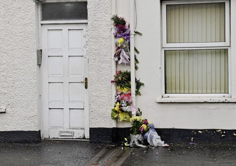 Flowers outside the flats where Tierna Campbell was found dead on Thursday of last week. Picture from Pacemaker 