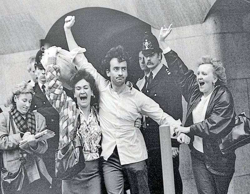 Flanked by his sisters, Gerry Conlon emerges from the Old Bailey in October 1989. Picture by Hugh Russell