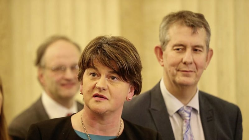 DUP leader Arlene Foster with executive ministers Edwin Poots and Peter Weir. Photo: Niall Carson/PA Wire. 