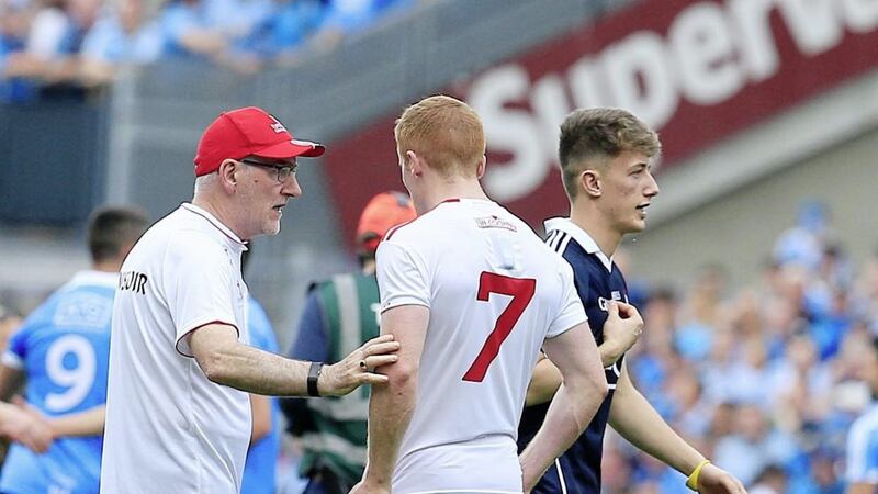 Mickey Harte commiserates with his nephew Peter at the final whistle of yesterday's All-Ireland final