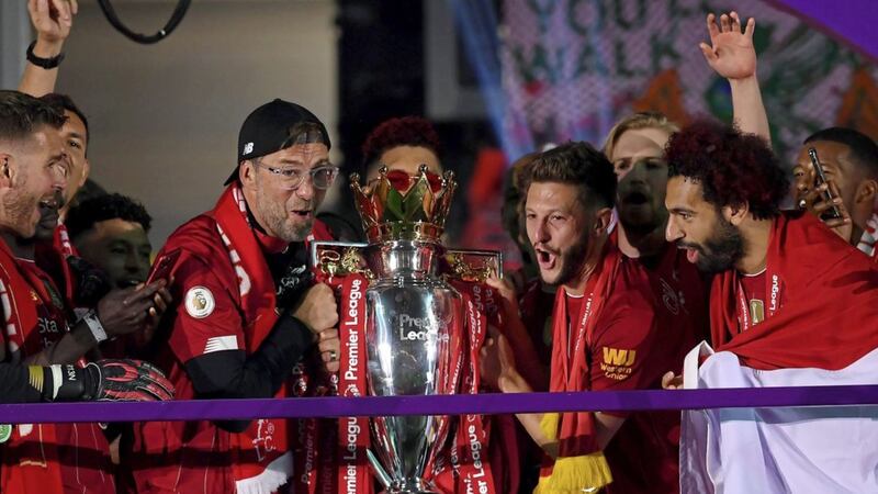 Liverpool manager Jurgen Klopp celebrates with the Premier League trophy after last night&#39;s victory over Chelsea. Picture by PA 