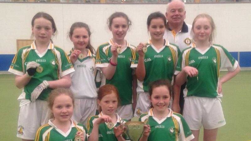 The Carrickmore girls from St Colmcille&rsquo;s primary school won the prestigious Ulster Cumann na mBunscol indoor football title recently. Mickey Quinn, chairman of Ulster Cumann na mBunscol, presented the team with the trophy. St Teresa's, Loughmacrory lifted the Ulster boys&rsquo; title