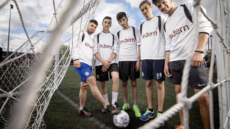Members of the Extern Eagles, a Belfast-based soccer team set up to help young Syrian refugees integrate and enhance their physical and mental wellbeing 