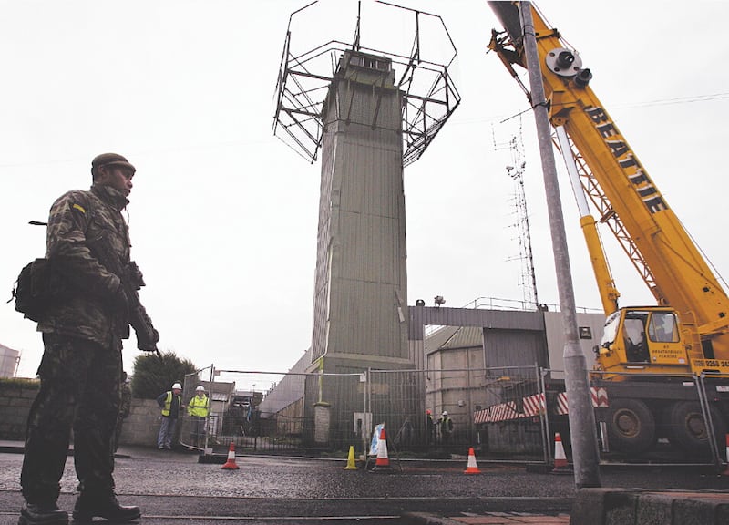Workmen begin dismantling the last remaining British army watchtower in Crossmaglen, south Armagh, in 2007. Picture by Mal McCann.