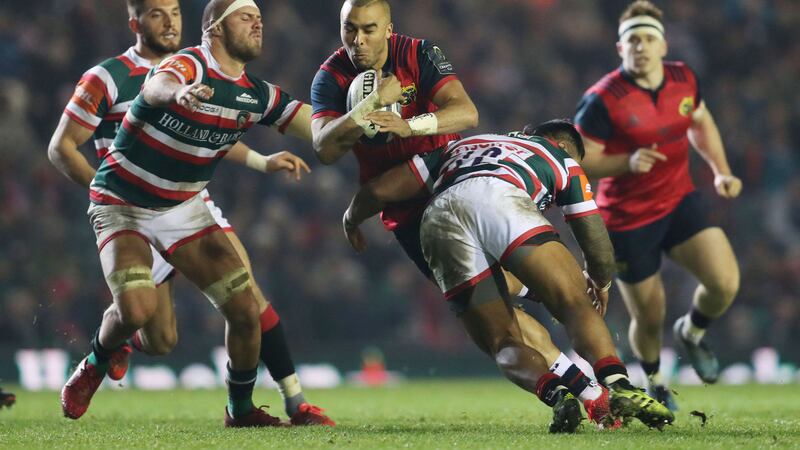 Munster's Simon Zebo is tackled by Leicester Tigers Lachlan McCaffrey and Manu Tuilagi during the European Champions Cup&nbsp;
