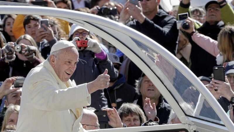 Pope Francis arrives in St Peter&#39;s Square yesterday for his weekly general audience at the Vatican 