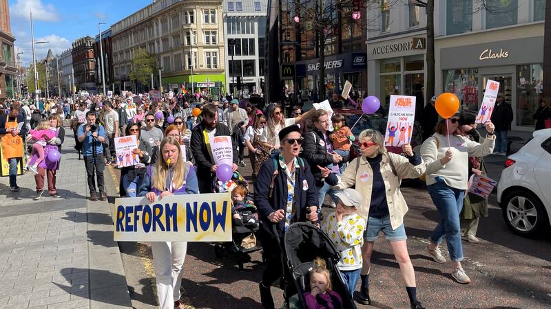 People take part in a childcare protest in Belfast city centre