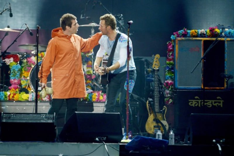 Liam Gallagher with Chris Martin at the Manchester gig (Dave Hogan for One Love Manchest/PA Wire/PA Images)