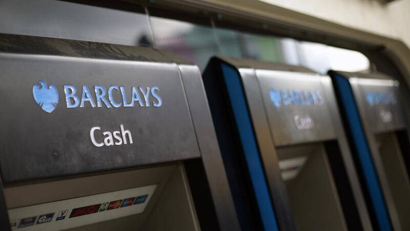 Cash machines at a Barclays bank in Islington, north London, as the bank&#39;s boss John McFarlane signalled plans to ramp up growth, squeeze costs and streamline the business after announcing a 25 per cent rise in first-half profits PICTURE: Yui Mok/PA 