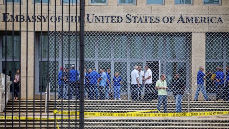 Staff stand at the US embassy in Havana on September 29. The Trump administration has described the 21 victims of the mysterious attacks as US embassy personnel 