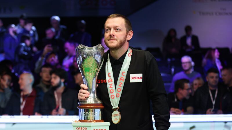  Mark Allen celebrates with the trophy after his win over Ding Junhui in the final of the Cazoo UK Snooker Championship at the York Barbican              Picture Isaac Parkin/PA