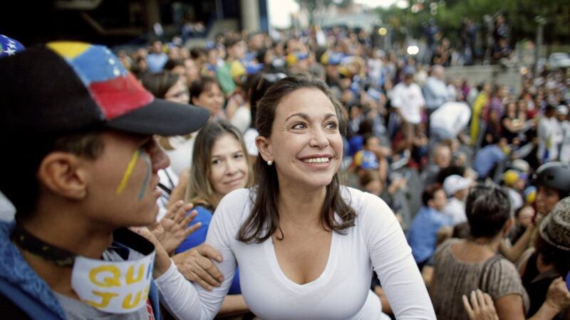 Opposition leader Maria Corina Machado, a former lawmaker, greets supporters during a vigil in honor of those who have been killed during clashes between security forces and demonstrators in Caracas, Venezuela Picture: Ariana Cubillos/AP 