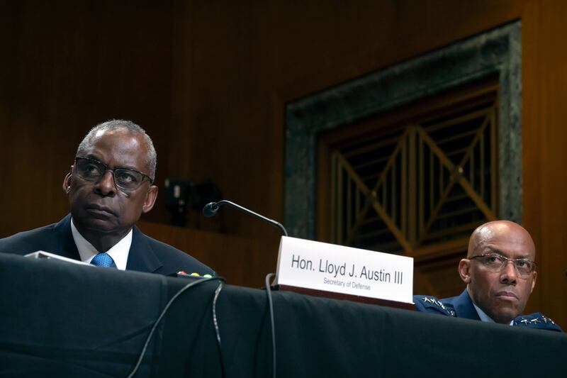 Secretary of Defence Lloyd Austin, left, and chairman of the Joint Chiefs of Staff Air Force General CQ Brown attend a hearing of the Senate Appropriations Committee Subcommittee on Defence (Mark Schiefelbein/AP)