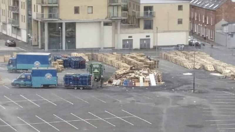 STORAGE: Belfast City Council workers removing pallets near the Holiday Inn in Belfast city centre 