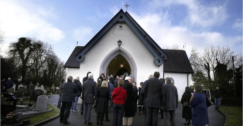 Mourners gathered at the church of St James of Jerusalem,Mullaghbrack for the funeral of Seamus Mallon. Picture by Hugh Russell 
