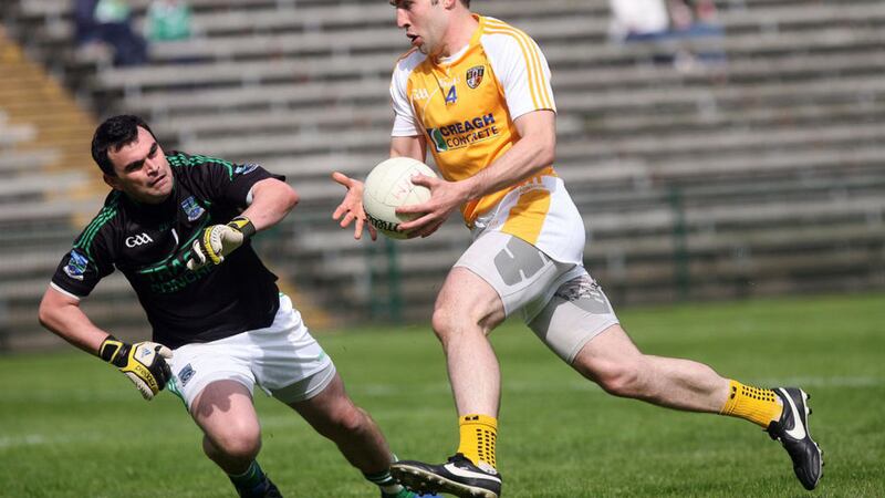Fermanagh Chris Snow watches as Antrim's Kevin Niblock goes past to score a goal. Picture by Colm O'Reilly