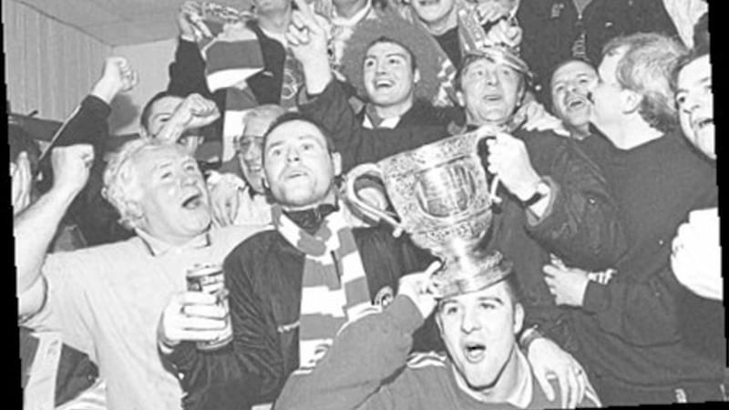 Marty Quinn and his Cliftonville squad celebrate in the dressing room after the club won the Irish League title for the first time in 88 years 