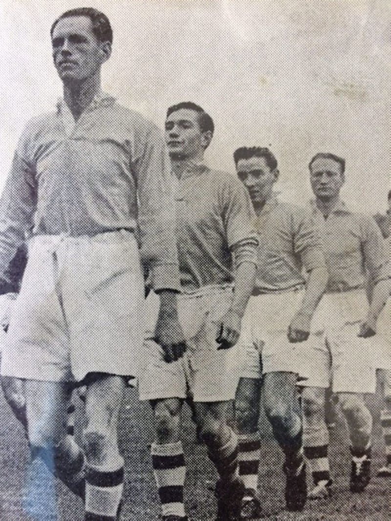 Iconic Gaelic footballer George Watterson, leading out the Antrim football team in 1946. 