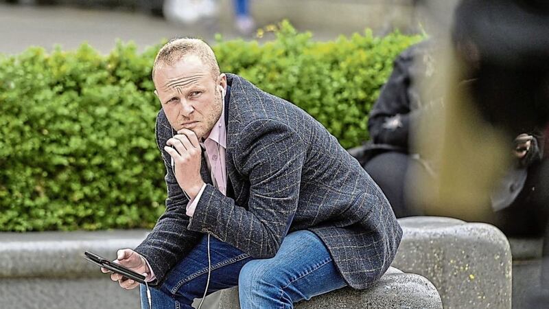 Jamie Bryson has instructed solicitors to take legal action against the person behind the &#39;Pastor Jimberoo&#39; twitter account 