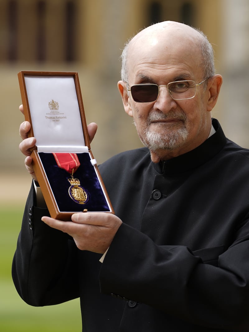 Sir Salman Rushdie after being made a Companion of Honour by the Princess Royal, during an investiture ceremony at Windsor Castle