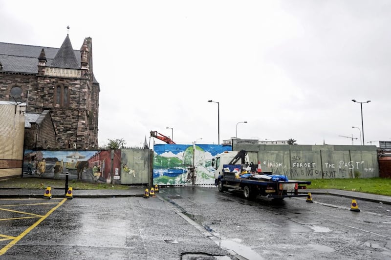 Work begins at the Townsend Street interface gates which form part of the peace wall between Belfast&#39;s Falls and Shankill roads Picture by Liam McBurney/PA 