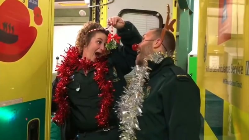 The festive music video features smiling paramedics twirling and jiving around Worthing Ambulance Station to the tune of Merry Christmas Everyone.