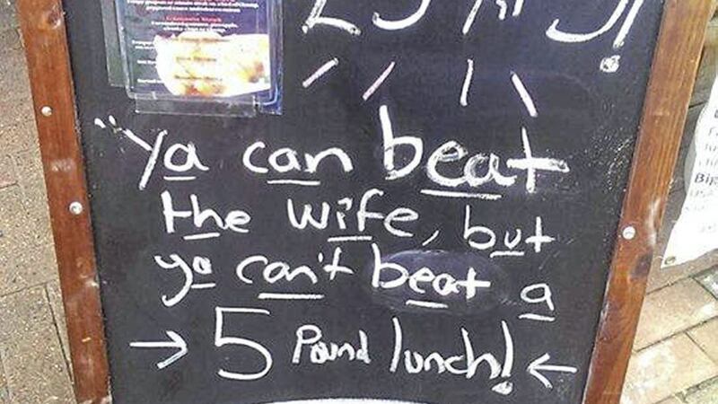 A chalkboard sign outside a Belfast restaurant which read: `Ya can beat the wife, but ya can&#39;t beat a 5 pound lunch&#39; has been criticised 