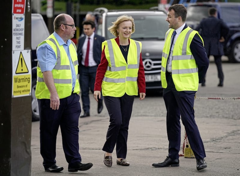 McCulla&#39;s Peter Summerton (left) with Liz Truss (centre) during her visit to the Lisburn premises in May 2022 to discuss the protocol in her capacity as UK Foreign Secretary. Picture by Niall Carson/PA 