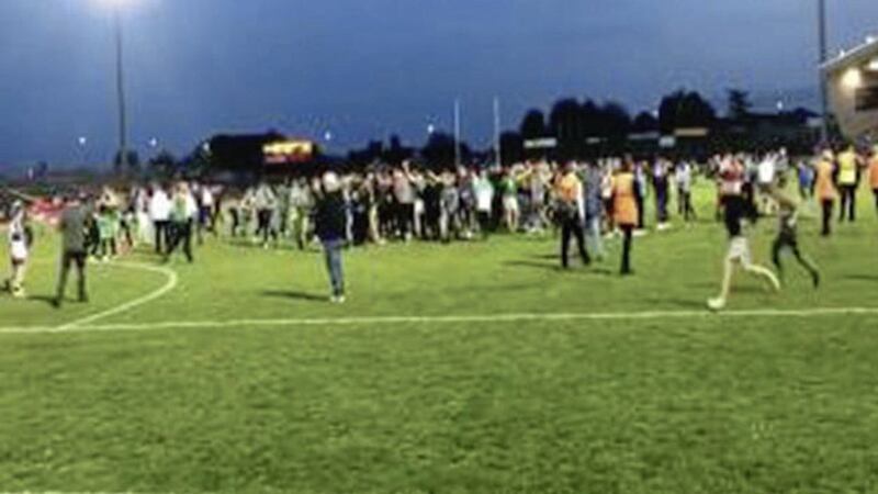 The pitch invasion by fans following Sunday&#39;s Tyrone club final 